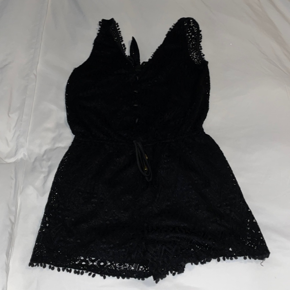 Alt. B Black romper with open back. Size L